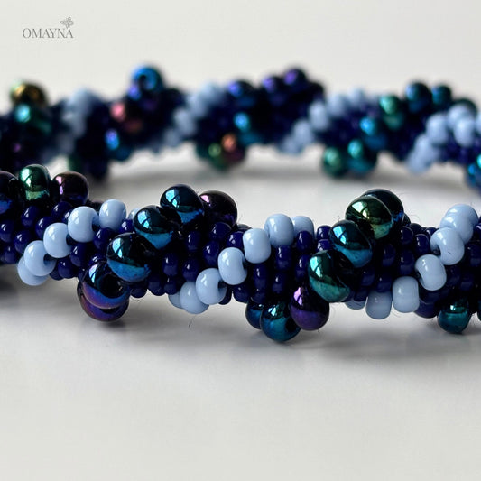 Detail of Mia beaded bracelet showing blue, purple and iridescent beads