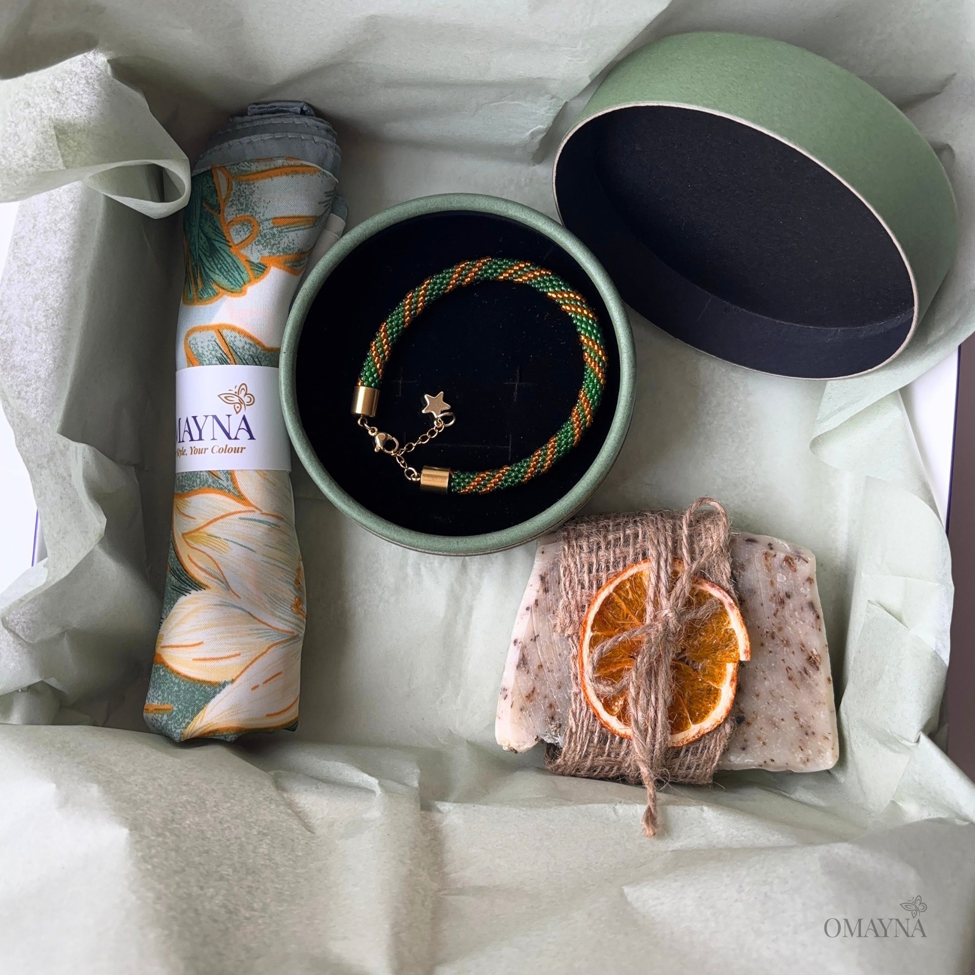 Jewellery set with a bracelet, soap, and scarf in a gift box