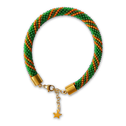 Emerald beaded bracelet with gold accents on a white background