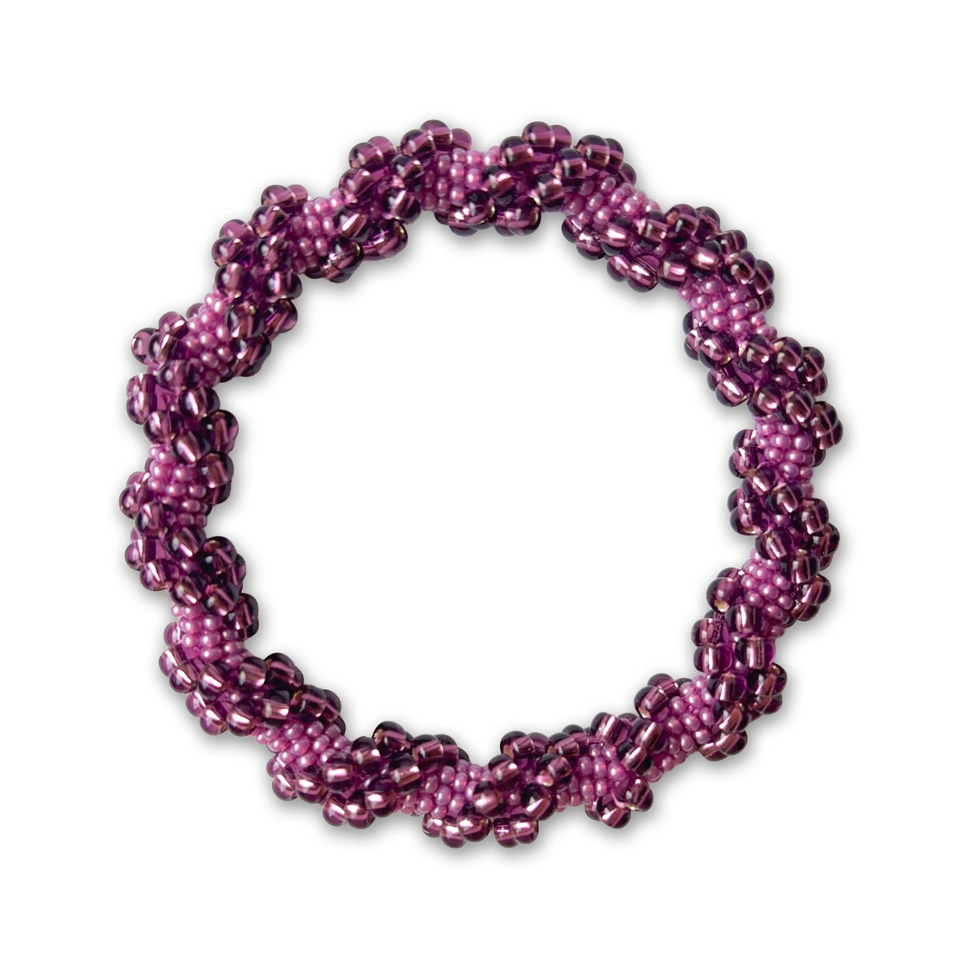Purple and pink beaded bracelet on a white background