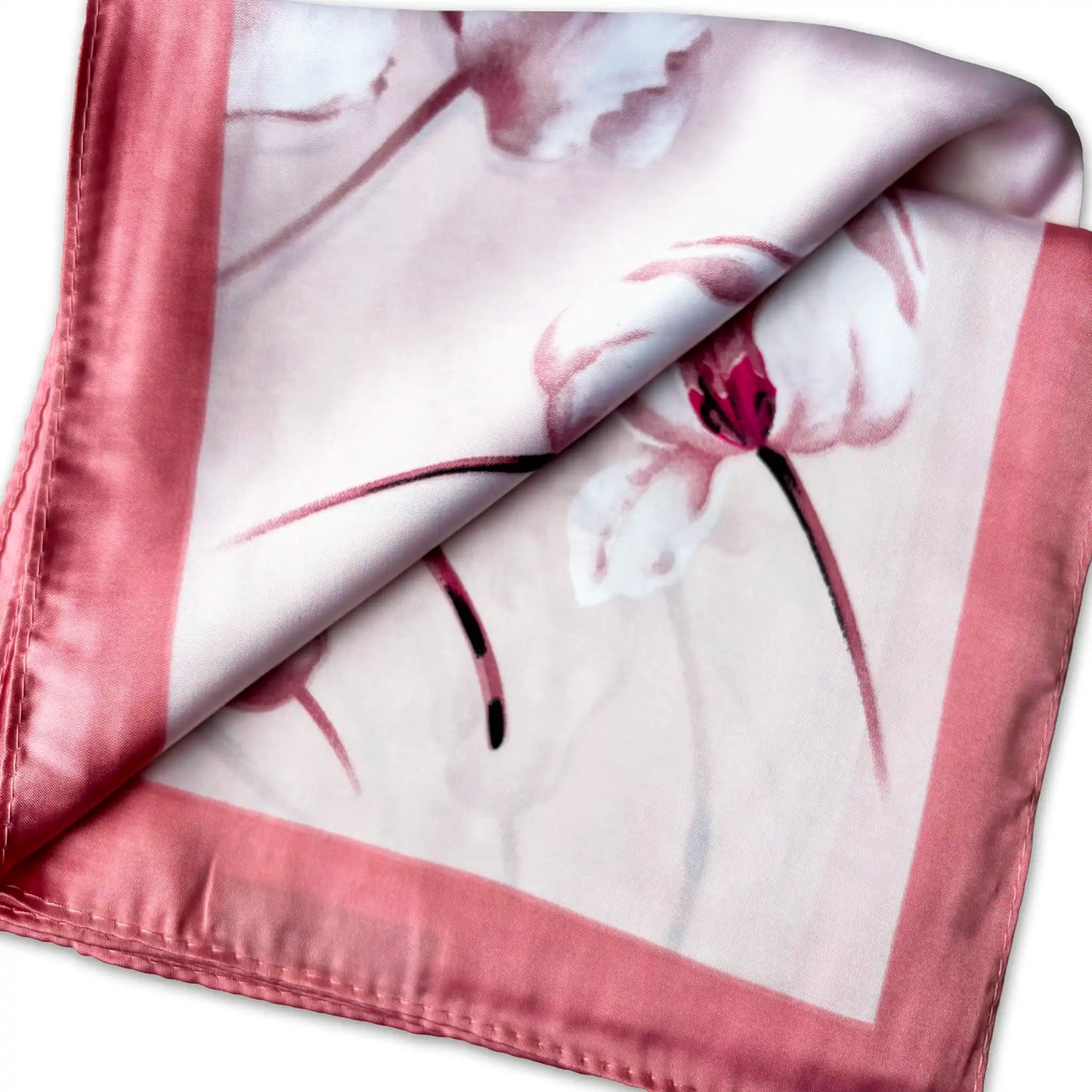Floral patterned silk scarf with pink border on a white background