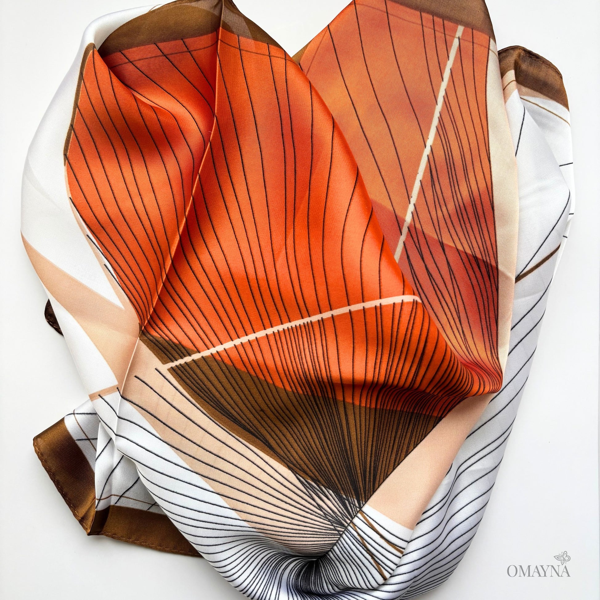 scarf in terracota tones on a white background