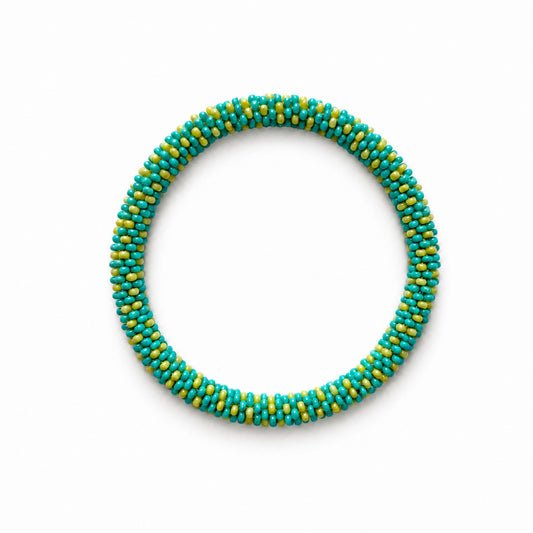 A circular beaded bracelet made of small turquoise and yellow-green beads, arranged in a clean oval on a white background.
