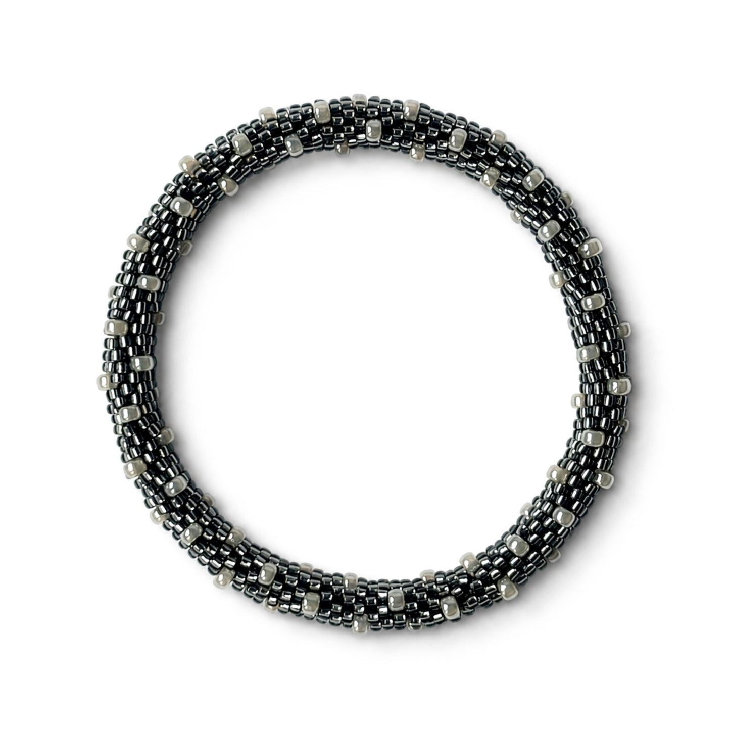 Grey and pearl beaded bracelet on a white background