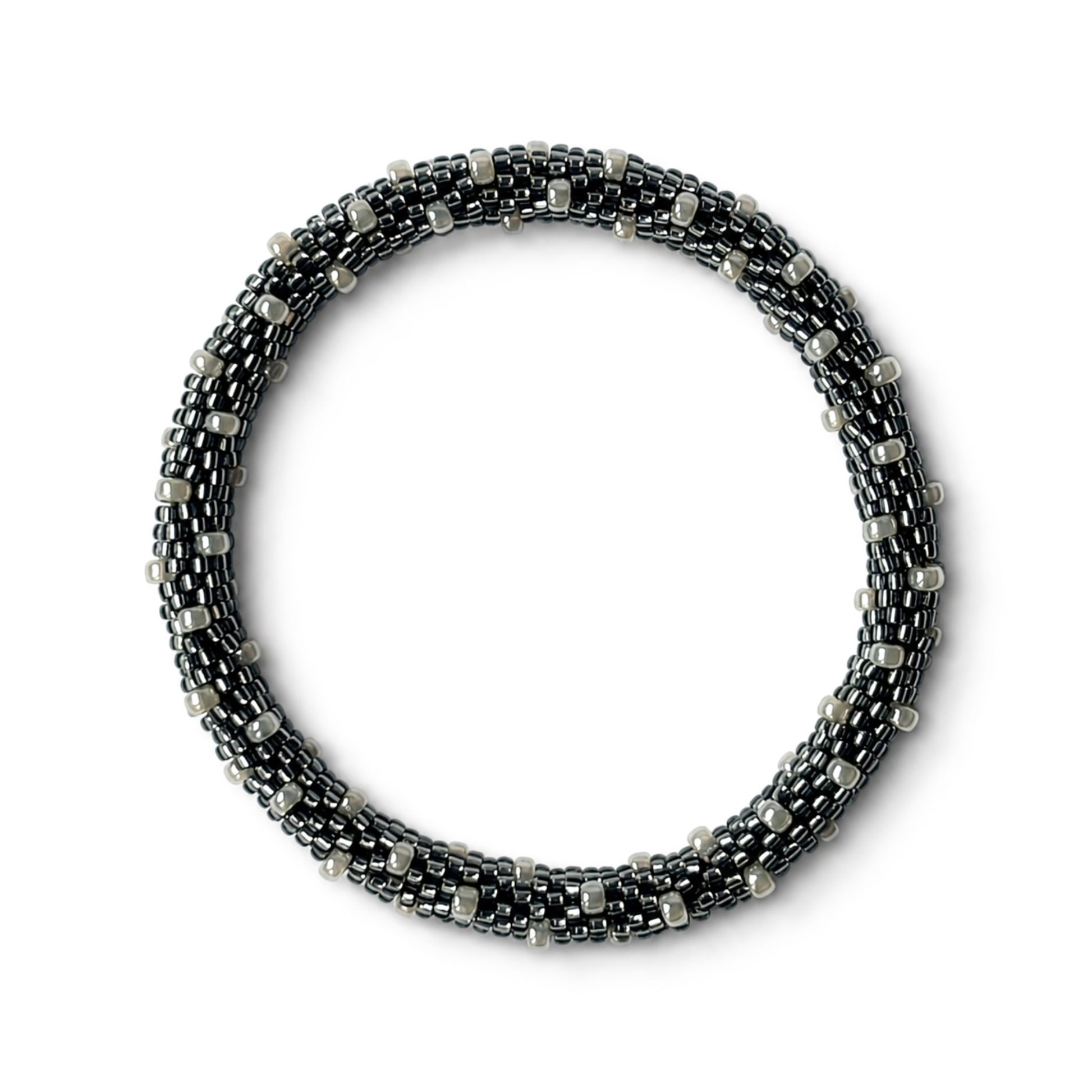 Grey and pearl beaded bracelet on a white background