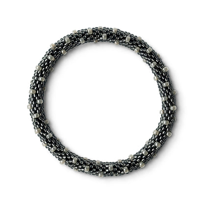 Grey and pearl beaded bracelet on a white background