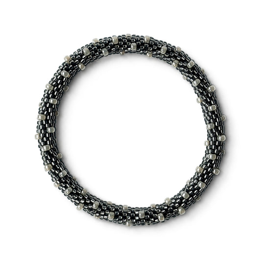 Grey and pearl beaded bracelet on a white background