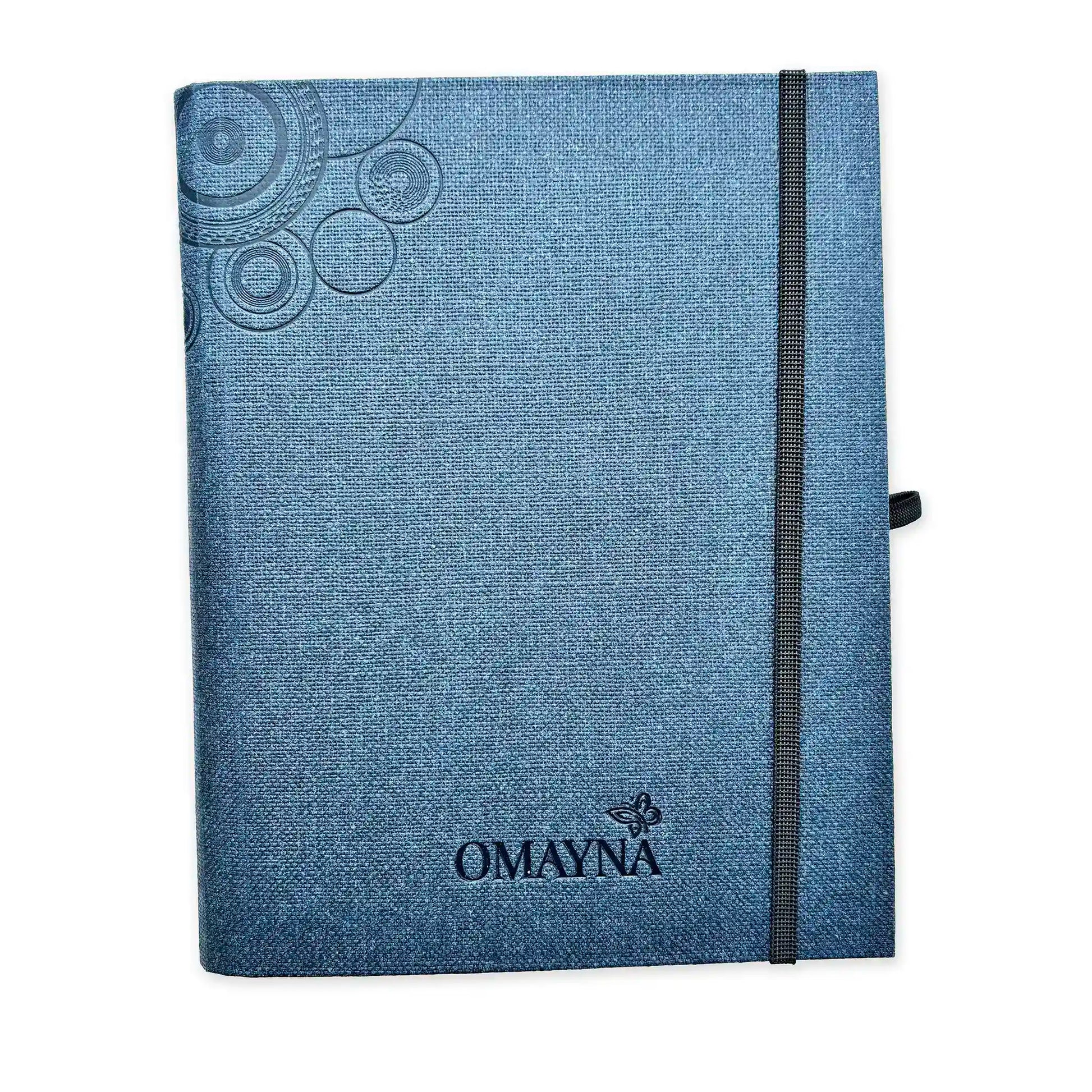 Dark Blue notebook with black strap closure on a white background with Omayna logo