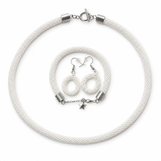 White beaded necklace with silver clasp and star charm, accompanied by matching earrings on a white background.