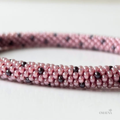 Lina beaded bracelet in soft pink tones with purple accents detail view