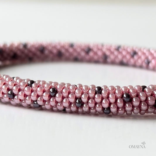 Lina beaded bracelet in soft pink tones with purple accents detail view