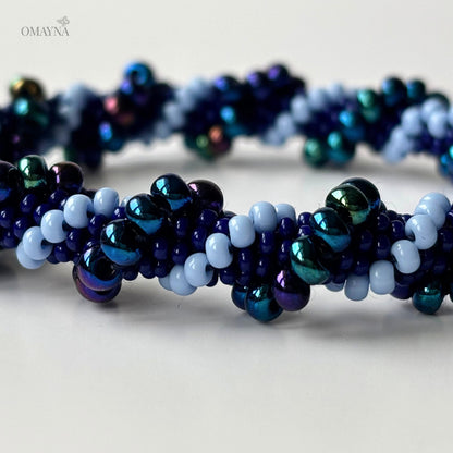 Detail of Mia beaded bracelet showing blue, purple and iridescent beads