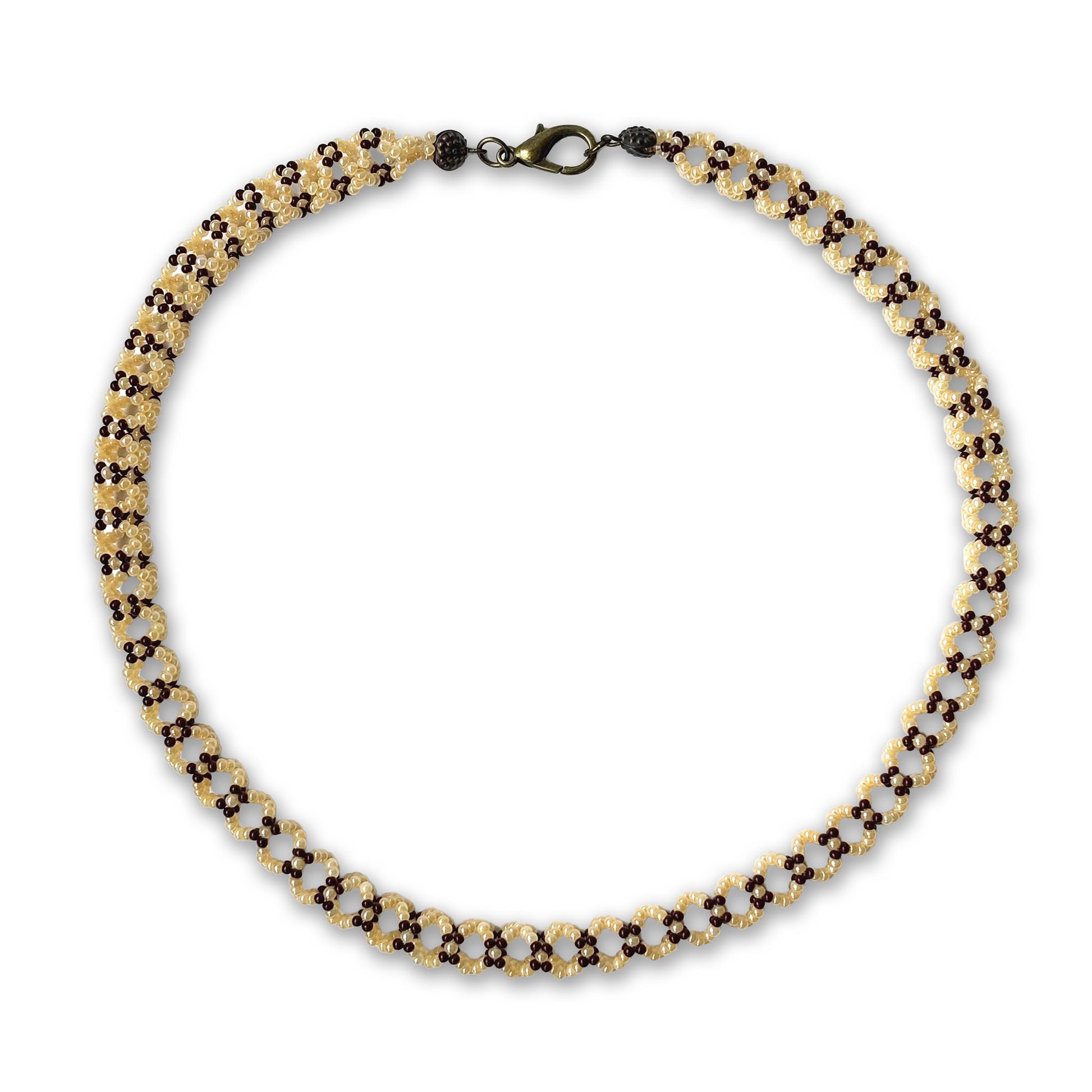Beaded necklace with brown and pearl beads on a white background