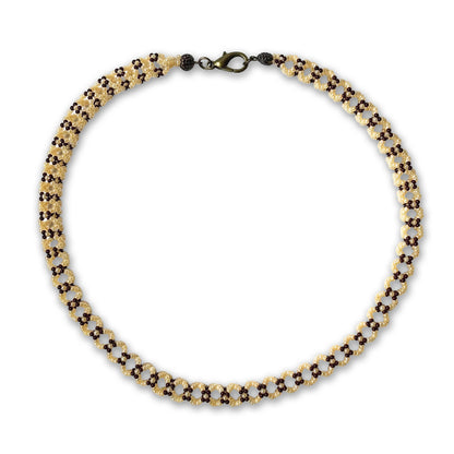 Beaded necklace with brown and pearl beads on a white background