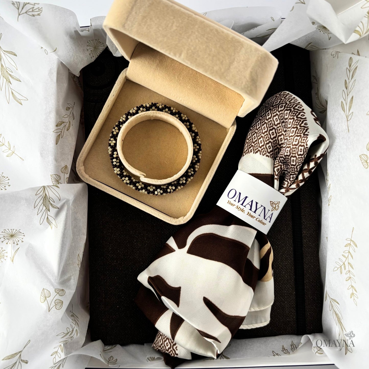 Gift box with a bracelet in a box, silk scarf and dark brown notebook