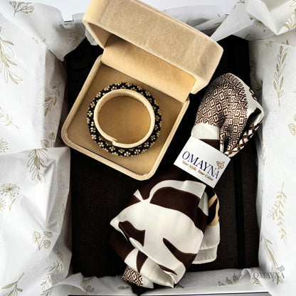 Gift box with a bracelet in a box, silk scarf and dark brown notebook