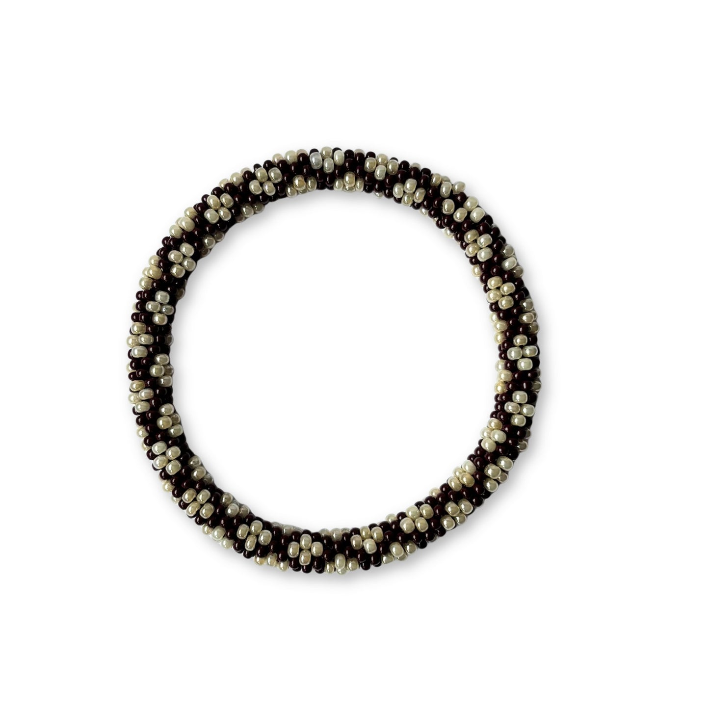 Beaded bracelet with alternating brown and beige beads on a white background