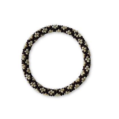 Beaded bracelet with alternating brown and beige beads on a white background