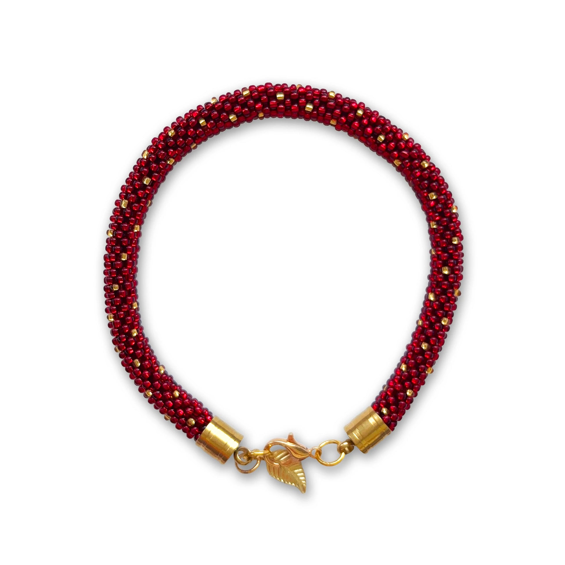 Bracelet in red and gold, part of the notebook set in crimson