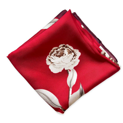 Red silk scarf with a floral design on a white background