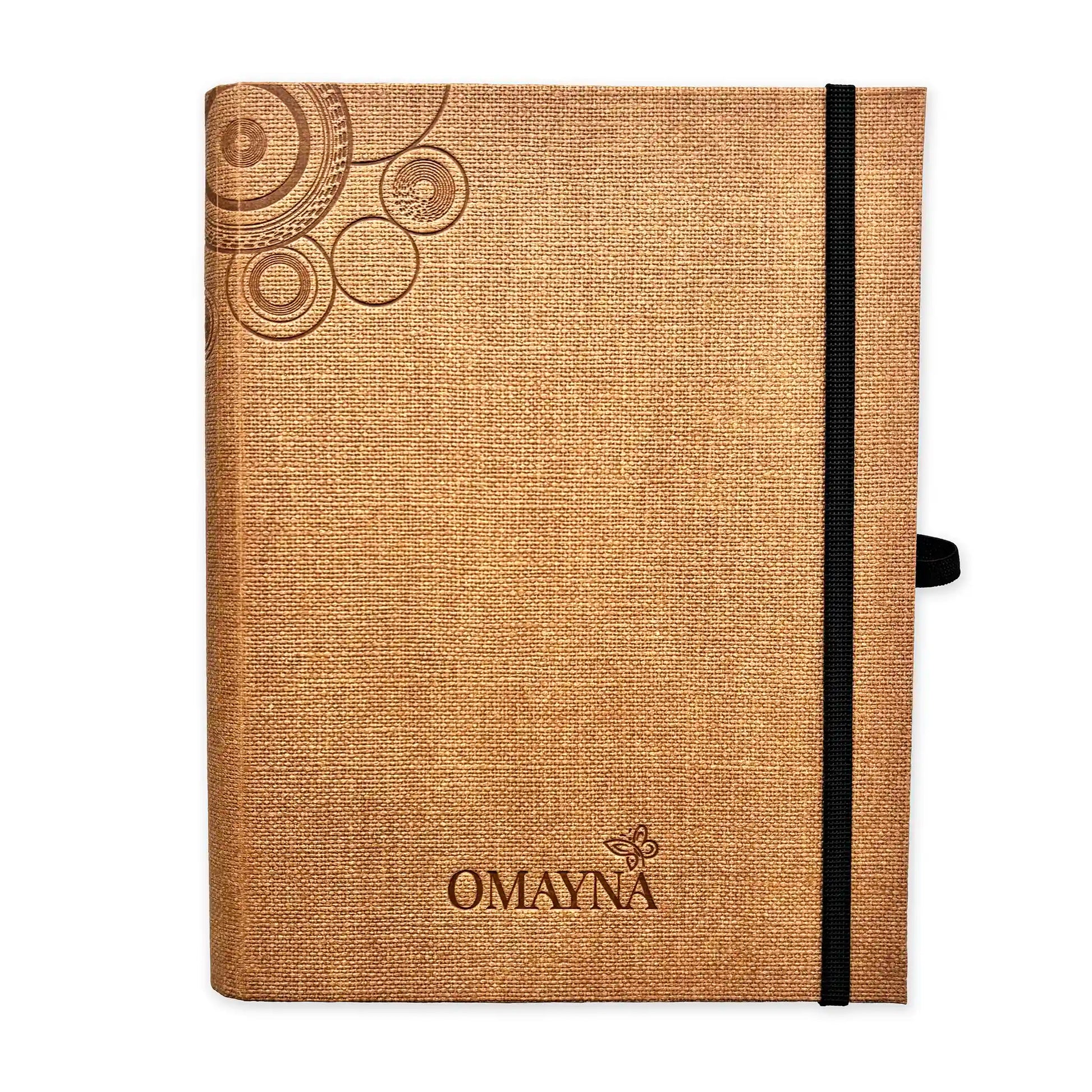 Terracota notebook with black strap closure on a white background with Omayna logo