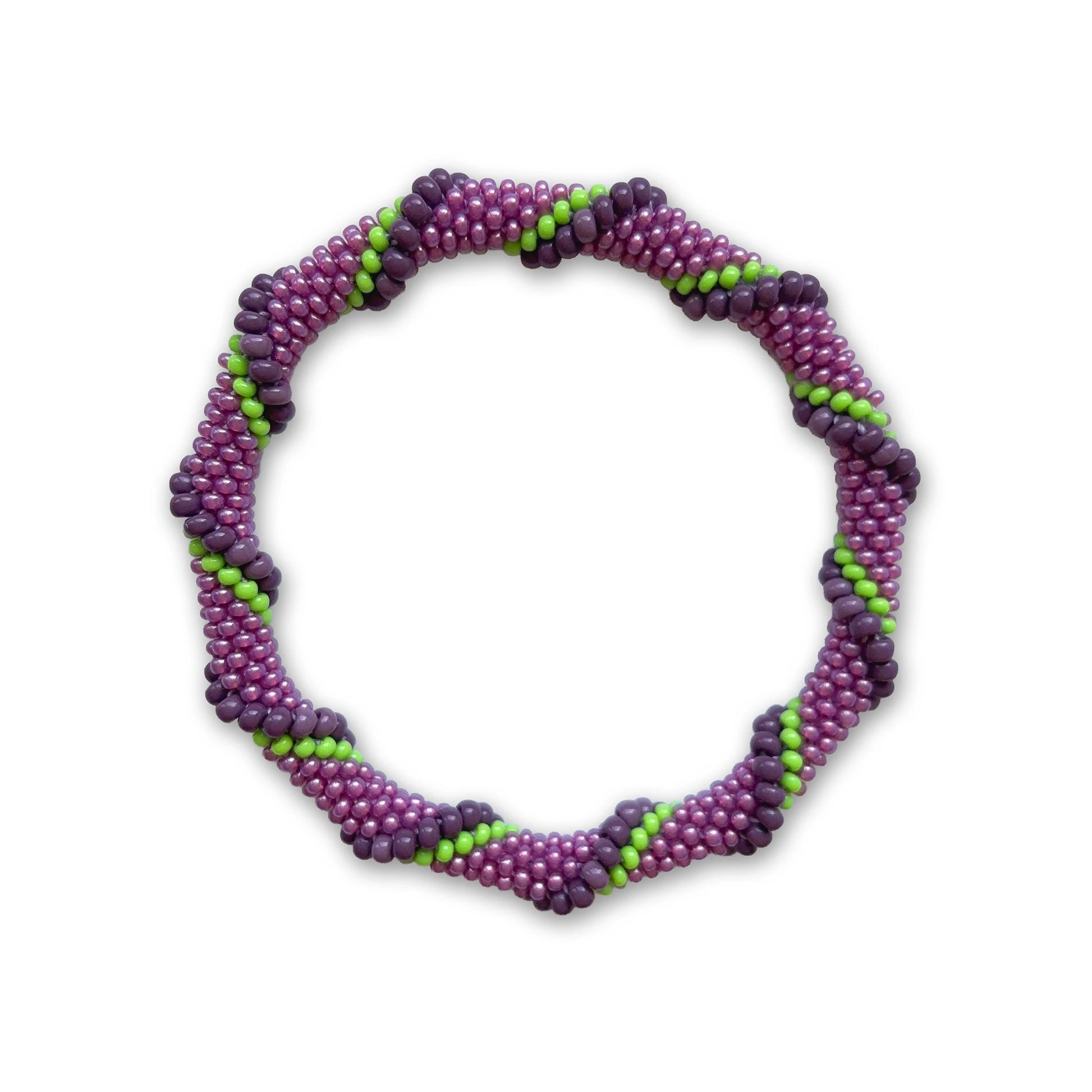 Purple and green beaded bracelet on a white background