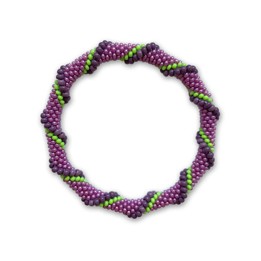 Purple and green beaded bracelet on a white background