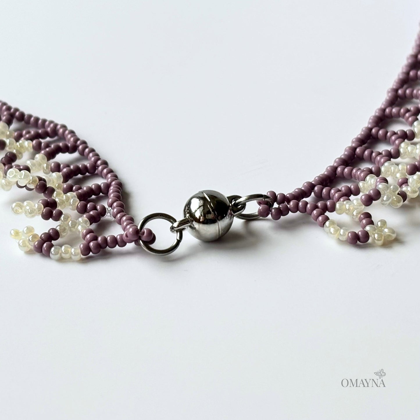 Una beaded necklace in soft purple and cream tones - clasp detail