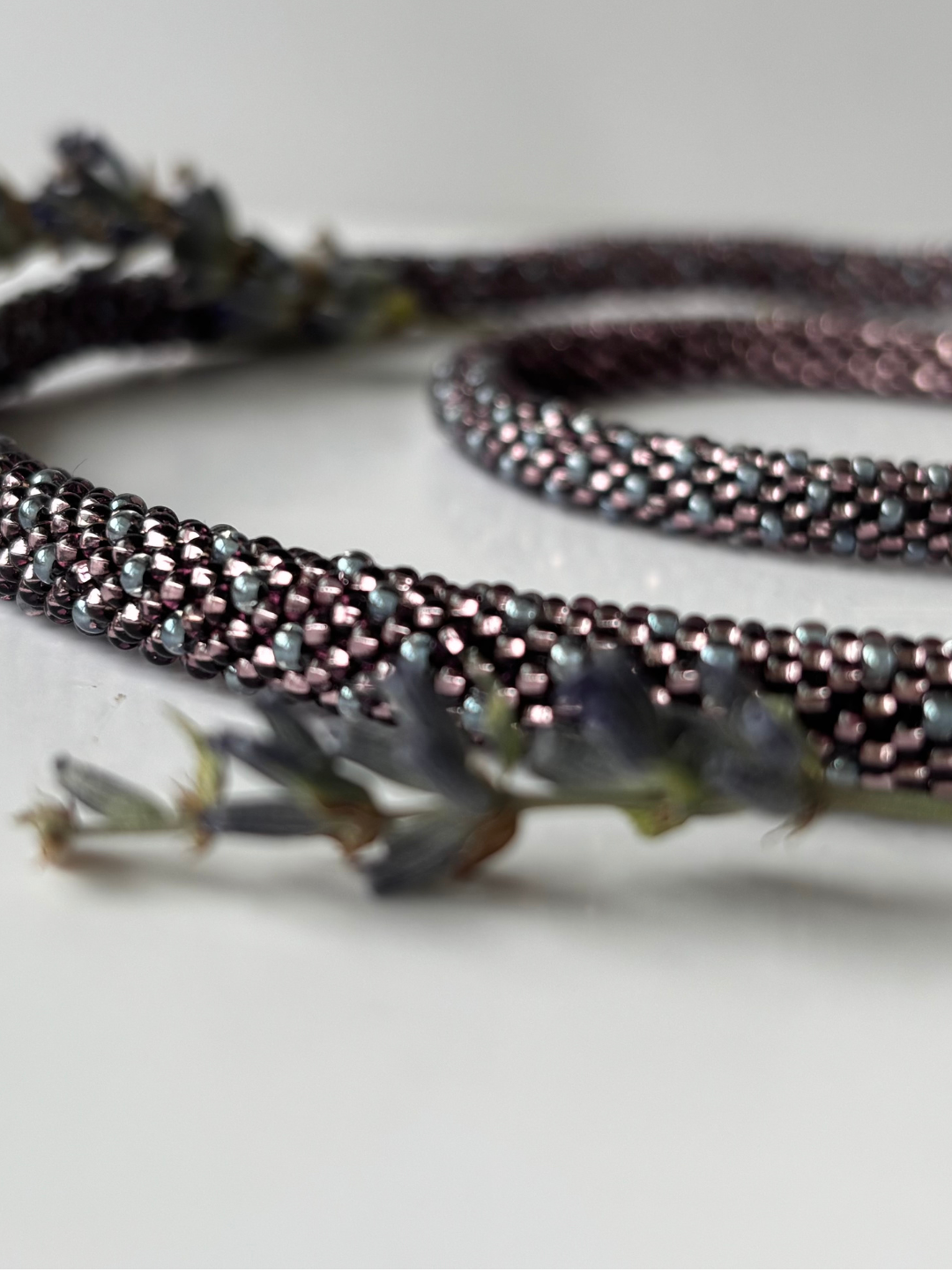 Close-up of  beaded bracelet and necklace on a white background