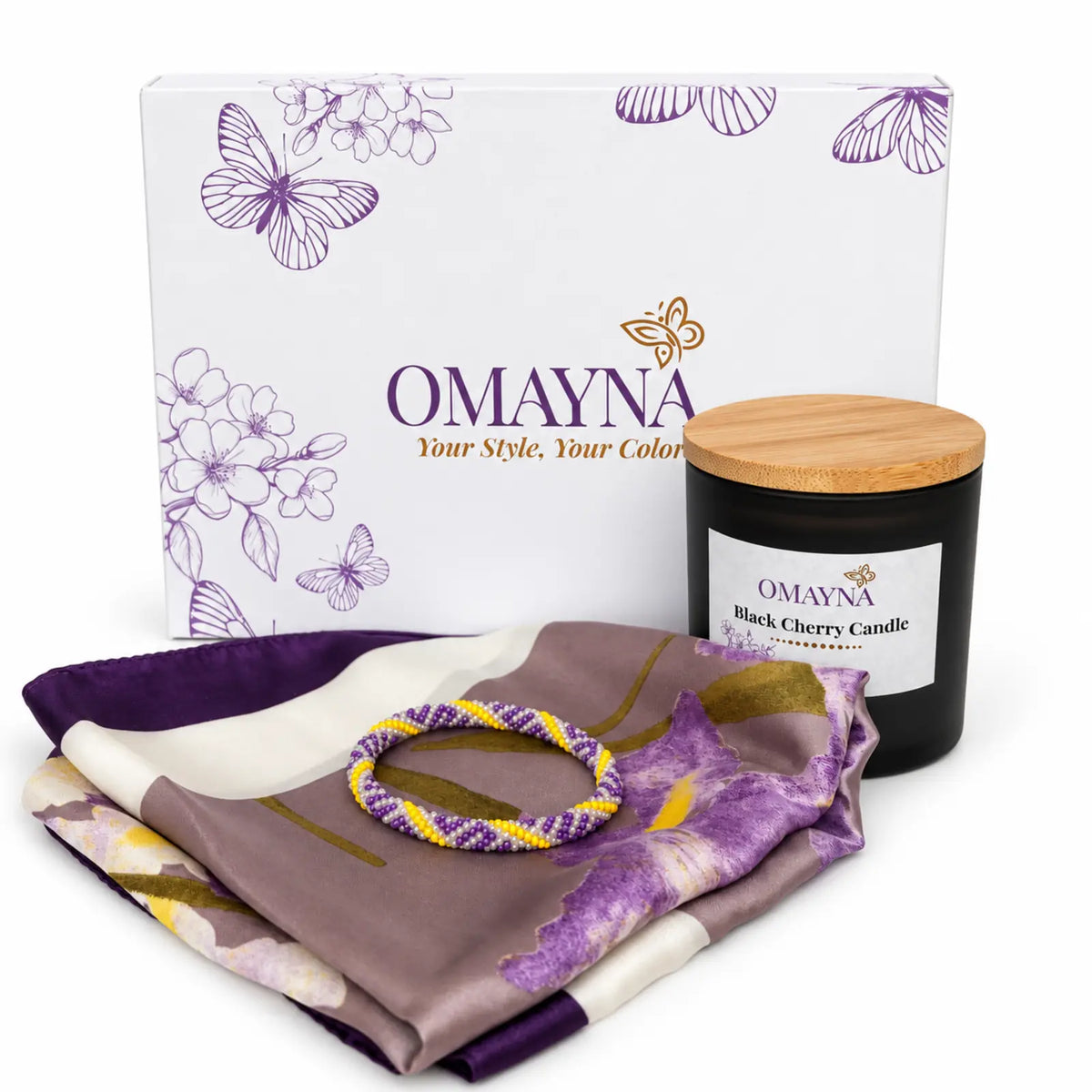 Omayna gift box with a purple and yellow bracelet, floral scarf and Black Cherry scented candle.